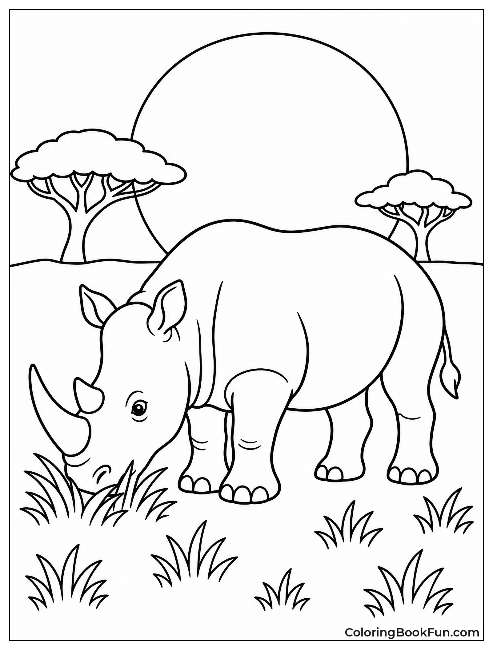 Rhino Grazing at Sunset