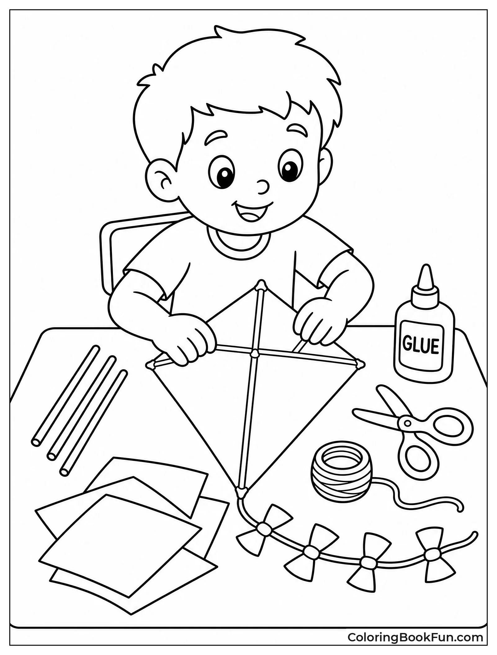 Child Builds Kite at Table
